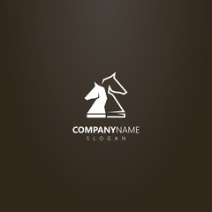 white logo on a black background. simple vector logo of two chess knight pieces © George_Chairborn
