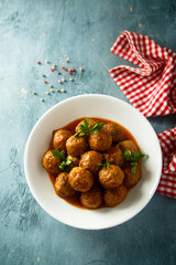 Meatballs with tomato sauce and parsley