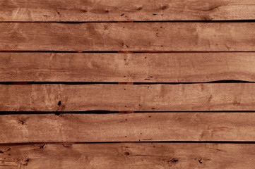 Obraz premium Backround. Horizontal arrangement of old boards in a wooden farm building.