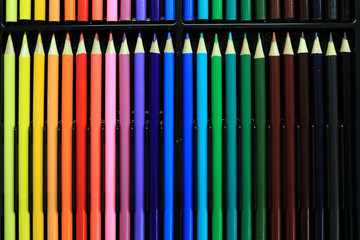 Color pencils pattern sort in box set colorful background.