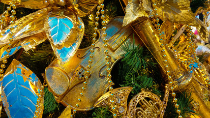 Detail of christmas tree with golden decoration