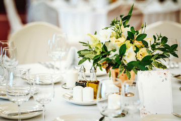 Wedding table set up. Indoor set up of a wedding/party table with  flower decoration