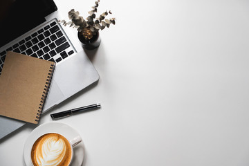 Office stuff with Movie clapper tablet, laptop ,smartphone and coffee cup notepad top view shot.