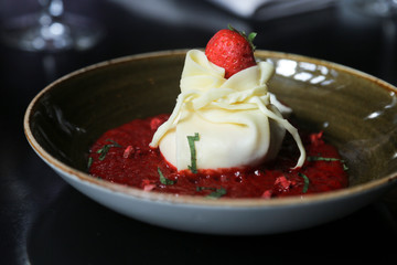 Cheese dessert with red berry sauce