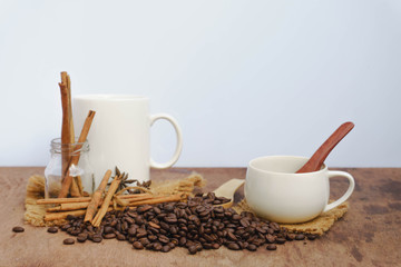 Coffee with cinnamon  on a wooden table. View from above