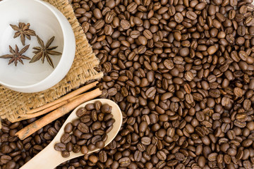 Coffee with cinnamon  on a wooden table. Top view from above