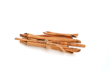 Cinnamon on a white background, light brown cinnamon on a white
