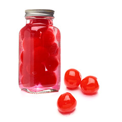 Maraschino cherries in jar isolated on white background