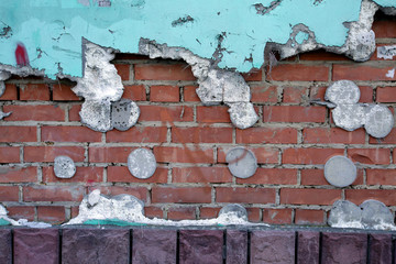 old brick wall with peeling paint