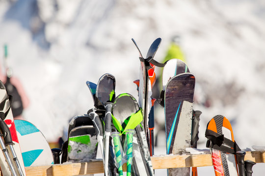 Image of multi-colored skis in snow at winter resort