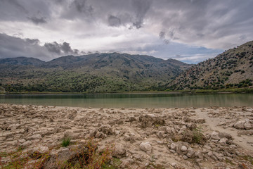 View of lake Kournas on Crete and clouds over the mountains