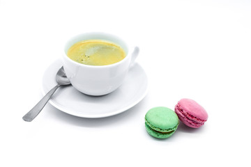 Coffee cup and macarons isolated on white background