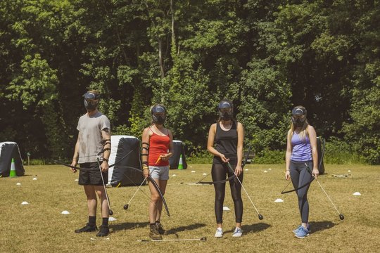 Group of people practicing archery at boot camp