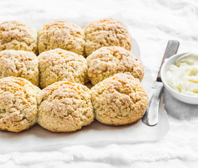 Wholegrain sweet scones on a light background. Delicious buns for breakfast