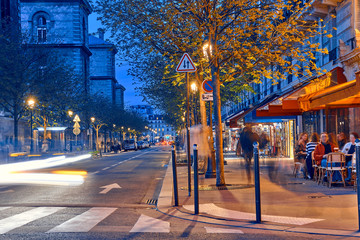 Tourist streets with cafes and restaurants in Paris at night