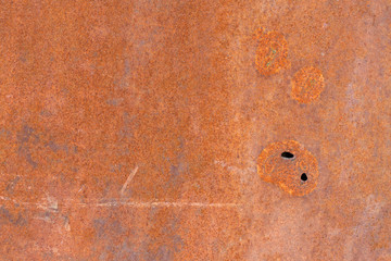 Rusted metal, rusty plate, shot holes