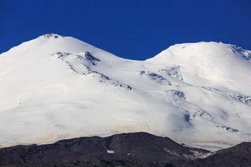 Fototapeta na wymiar View of the saddle of Mount Elbrus from the north of the Caucasus Mountains in Russia.