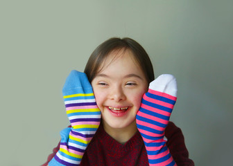 Beautiful girl smiling with socks - 230787166