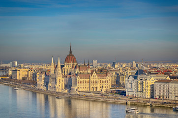 Fototapeta na wymiar Parliament building on the east bank of the Danube, Budapest, Hungary. Winter landscape on a sunny day.