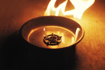 Old pentagram burning in flames