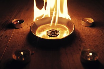 Old pentagram burning in flames