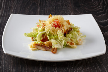 Fruit and vegetable salad with meat. Side view.