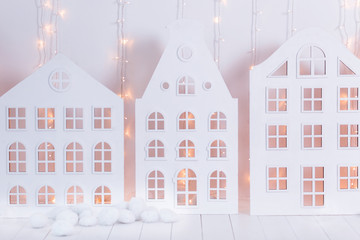 Fairytale Christmas interior with a white multistory houses and garlands. New year decoration. Holiday card. Christmas background. 