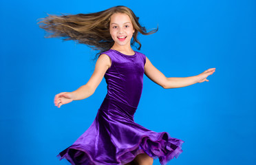Ballroom fashion. Girl child wear velvet violet dress. Kid fashionable dress looks adorable. Ballroom dancewear fashion concept. Kid dancer satisfied with concert outfit. Clothes for ballroom dance