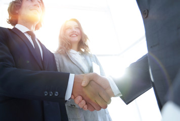 Photo of handshake of two happy businessmen