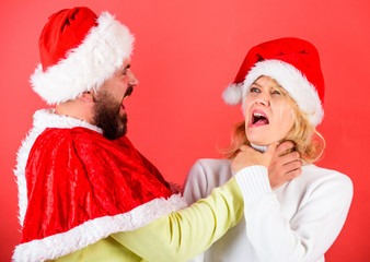 Couple celebrate winter holiday christmas. Christmas masquerade or karnival concept. Girl choking...