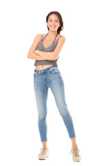Fototapeta premium Full body happy young asian woman posing with arms crossed against isolated white background