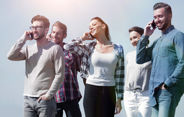 group of young people with smartphones