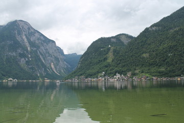 lake on the background of Alpine mountains in summer