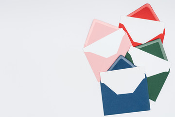 close-up view of colorful envelopes with blank cards isolated on white background
