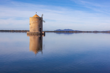 Picturesque old windmill in the lagoon Orbetello on the peninsula Argentario in Tuscany, Italy