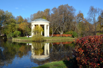 Gazebo on the pond in the autumn Park