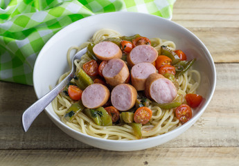 Sausage pasta - Spaghetti with slices of continental smoked sausage with cherry tomatoes and green pepper