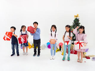 group of kids celebrate party and enjoy christmas fun together