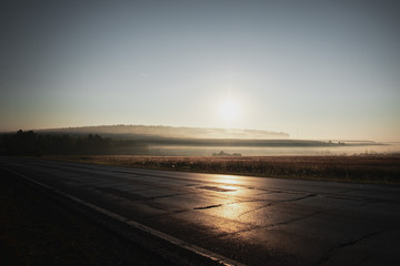 foggy morning summer landscape at sunrise