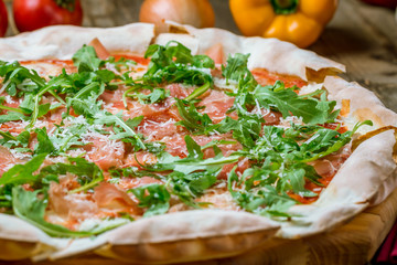 Pizza with Parma ham and arugula