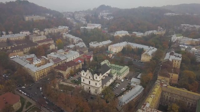 Aerial: The church of Saint Arkhystratyh Michael in Lviv in misty weather