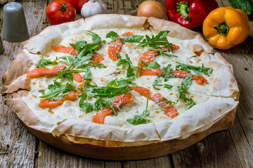 Pizza with salmon and Philadelphia cheese