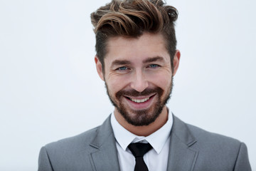 Serious businessman wearing suit and tie. blue background