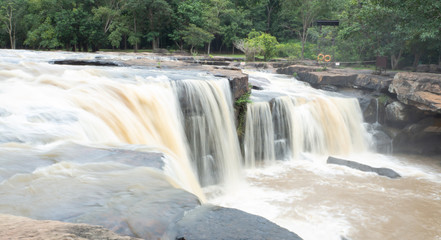 Obraz premium Tad Ton Waterfall Sing of Tad Ton National park in Chaiyaphum,Thailand, Concept rainy season waterfall travel must be careful damage caused by water change color It is a dangerous signal.