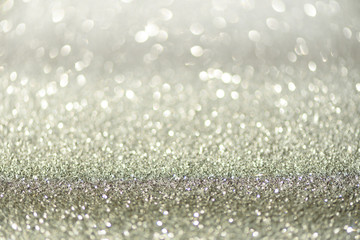 Silver abstract bokeh lights. Defocused background with copy space. New year and Christmas concept. Greeting card