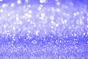 Blue and silver abstract bokeh lights. Shiny glitter background with copy space. New year and Christmas concept. Sparkling greeting card