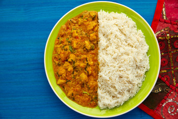 Chicken curry dish indian recipe on blue