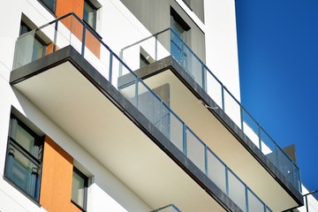Modern apartment buildings on a sunny day with a blue sky. Facade of a modern apartment building