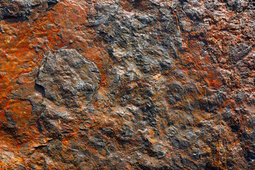 Stone texture in the beach shore with red
