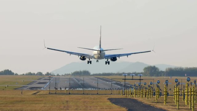 Airplane landing on runway at afternoon 4K clog footage